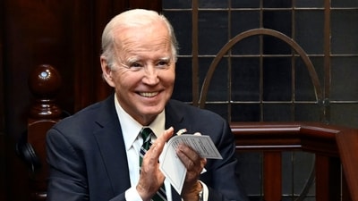 Joe Biden in Ireland: President Joe Biden looks up and applauds as he is seated before addressing members of the Irish parliament at Leinster House in Dublin. (AP) Joe Biden in Ireland: President Joe Biden looks up and applauds as he is seated before addressing members of the Irish parliament at Leinster House in Dublin. (AP)