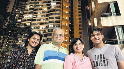 Mumbai, India - April 11, 2023: Rajiv Mohta, of the residents of Patrawala Chawl who fought for his flat together with the home buyers in the project, poses with his family outside the building, at Jogeshwari, in Mumbai, India, on Tuesday, April 11, 2023. (Photo by Satish Bate/Hindustan Times) (Satish Bate/HT PHOTO) Mumbai, India - April 11, 2023: Rajiv Mohta, of the residents of Patrawala Chawl who fought for his flat together with the home buyers in the project, poses with his family outside the building, at Jogeshwari, in Mumbai, India, on Tuesday, April 11, 2023. (Photo by Satish Bate/Hindustan Times) (Satish Bate/HT PHOTO)