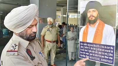 The Government Railway Police (GRP) on Thursday put up ‘wanted’ posters of pro-Khalistan leader and Waris Punjab De head Amritpal Singh, who continues to evade arrest since March 18, at railway station Amritsar district. (File) The Government Railway Police (GRP) on Thursday put up ‘wanted’ posters of pro-Khalistan leader and Waris Punjab De head Amritpal Singh, who continues to evade arrest since March 18, at railway station Amritsar district. (File)
