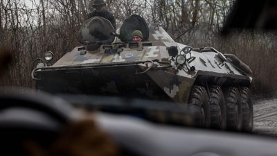 Russia-Ukraine War: Ukrainian servicemen ride on an armoured personnel carrier on a road near the town of Bakhmut. (AFP)