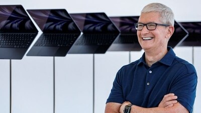 FILE PHOTO: Apple CEO Tim Cook poses in front of a new MacBook Airs running M2 chips display during Apple's annual Worldwide Developers Conference in San Jose, California, U.S. June 6, 2022. REUTERS/Peter DaSilva (REUTERS)