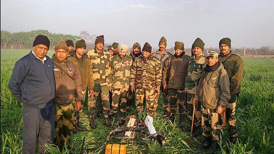 BSF personnel after shooting down a Pakistani drone entering India from along the International Border in Punjab on Feb 3. (PTI)