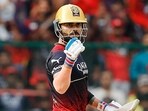 Royal Challengers Bangalore's Virat Kohli celebrates his half-century Royal Challengers Bangalore's Virat Kohli celebrates his half-century