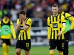 Borussia Dortmund's Marco Reus and Raphael Guerreiro look dejected after the match 
