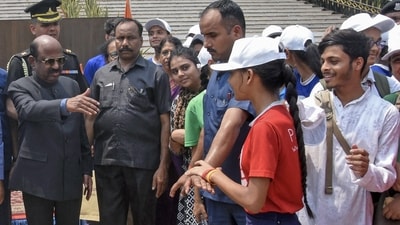 West Bengal Governor CV Ananda Bose allows a student to join him as security personnel during the school children's visit to Raj Bhawan on the occasion of Bengali New Year. (ANI) West Bengal Governor CV Ananda Bose allows a student to join him as security personnel during the school children's visit to Raj Bhawan on the occasion of Bengali New Year. (ANI)