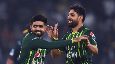 Pakistan's captain Babar Azam (L) celebrates with teammate Haris Rauf after the dismissal of New Zealand's Mark Chapman (not pictured) during the first Twenty20 cricket match between Pakistan and New Zealand at the Gaddafi Cricket Stadium in Lahore on April 14, 2023. (Photo by Arif ALI / AFP) (AFP) Pakistan's captain Babar Azam (L) celebrates with teammate Haris Rauf after the dismissal of New Zealand's Mark Chapman (not pictured) during the first Twenty20 cricket match between Pakistan and New Zealand at the Gaddafi Cricket Stadium in Lahore on April 14, 2023. (Photo by Arif ALI / AFP) (AFP)