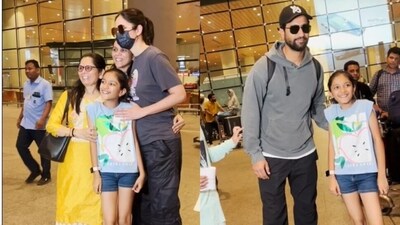 Katrina Kaif and Vicky Kaushal posed with fans at the Mumbai airport. Katrina Kaif and Vicky Kaushal posed with fans at the Mumbai airport.