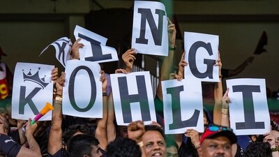 Fans cheer for Virat Kohli. (PTI) Fans cheer for Virat Kohli. (PTI)