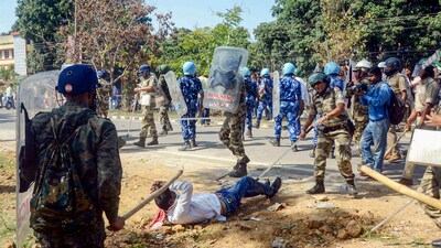 Police personnel wield batons against Bharatiya Janata Party (BJP) supporters to disperse them during BJP's protest against the state government, near the secretariat in Ranchi, Tuesday, April 11, 2023. (PTI) Police personnel wield batons against Bharatiya Janata Party (BJP) supporters to disperse them during BJP's protest against the state government, near the secretariat in Ranchi, Tuesday, April 11, 2023. (PTI)