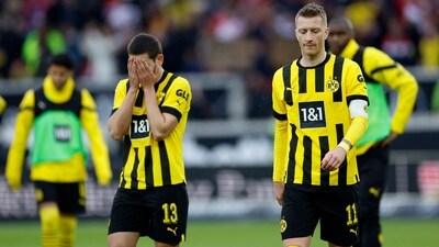 Borussia Dortmund's Marco Reus and Raphael Guerreiro look dejected after the match (REUTERS)