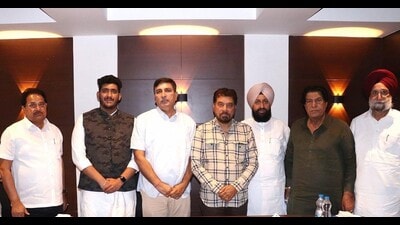 Surinder Chaudhary, son of five-time MLA Chaudhary Jagjit Singh, with Congress leaders in Amritsar on Saturday. (HT Photo) Surinder Chaudhary, son of five-time MLA Chaudhary Jagjit Singh, with Congress leaders in Amritsar on Saturday. (HT Photo)