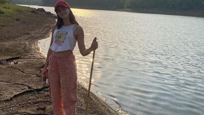 In one of the pictures, Ananya Panday stood near a lake with a stick in her hand. She was dressed in a T-shirt, pink pants and also a cap. In one of the pictures, Ananya Panday stood near a lake with a stick in her hand. She was dressed in a T-shirt, pink pants and also a cap. 