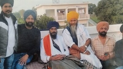 Punjab Police releases a picture of 'Waris Punjab De' chief Amritpal Singh's main aide Joga Singh (in yellow turban). Punjab Police releases a picture of 'Waris Punjab De' chief Amritpal Singh's main aide Joga Singh (in yellow turban).