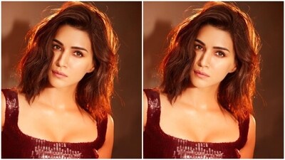 Kriti looked every bit gorgeous in the maroon sleeveless cropped top featuring sequin details throughout. Baring her toned midriff, Kriti further teamed it with a matching bodycon long skirt with a thigh high slit on one side.&nbsp; (Instagram/@kritisanon)