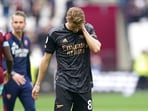 Arsenal's Martin Odegaard reacts after the English Premier League soccer match against West Ham at the London Stadium, London, Sunday April 16, 2023. (Adam Davy/PA via AP) Arsenal's Martin Odegaard reacts after the English Premier League soccer match against West Ham at the London Stadium, London, Sunday April 16, 2023. (Adam Davy/PA via AP)