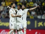 Real Madrid's Nacho, centre, celebrates with teammates after scoring the opening goal during the Spanish La Liga soccer match between Cadiz CF and Real Madrid at the Nuevo Mirandilla stadium in Cadiz, Spain, Saturday, April 15, 2023. (AP Photo/Jose Breton) Real Madrid's Nacho, centre, celebrates with teammates after scoring the opening goal during the Spanish La Liga soccer match between Cadiz CF and Real Madrid at the Nuevo Mirandilla stadium in Cadiz, Spain, Saturday, April 15, 2023. (AP Photo/Jose Breton)