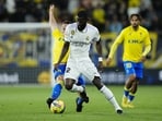 Real Madrid's Antonio Rudiger, centre, and Cadiz's Fede San Emeterio, left, challenge for the ball during the La Liga match between Cadiz CF and Real Madrid.