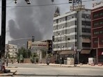 Smoke is seen rising from a neighborhood in Khartoum, Sudan, Saturday, April 15. 