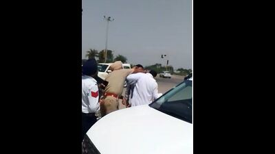 A video grab of the traffic cop punching the man in Zirakpur on Sunday. (HT) A video grab of the traffic cop punching the man in Zirakpur on Sunday. (HT)