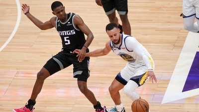 Golden State Warriors guard Stephen Curry (30) turns the ball over while dribbling next to Sacramento Kings guard De'Aaron Fox (5) in the second quarter during game one of the 2023 NBA playoffs at the Golden 1 Center. Mandatory Credit: Cary Edmondson-USA TODAY Sports (USA TODAY Sports via Reuters Con)