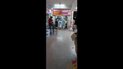 Chandigarh health secretary Yashpal Garg, disguised as a patient, buying the prescribed syrup from shop number 6, the only shop to stock it at GMSH, Sector 16. (HT) Chandigarh health secretary Yashpal Garg, disguised as a patient, buying the prescribed syrup from shop number 6, the only shop to stock it at GMSH, Sector 16. (HT)
