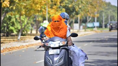 Girls driving on a hot sunny day in Ludhiana on Sunday. (Manish/HT) Girls driving on a hot sunny day in Ludhiana on Sunday. (Manish/HT)