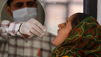 Jammu: A healthcare worker collects a swab sample of a woman for Covid-19 test, amid a rise in coronavirus cases in the country, in Jammu, Saturday, April 15, 2023. (PTI Photo)(PTI04_15_2023_000022B) (PTI) Jammu: A healthcare worker collects a swab sample of a woman for Covid-19 test, amid a rise in coronavirus cases in the country, in Jammu, Saturday, April 15, 2023. (PTI Photo)(PTI04_15_2023_000022B) (PTI)