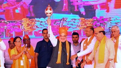**EDS: TWITTER IMAGE VIA @AmitShah** Bharatpur: Union Home Minister Amit Shah with former Rajasthan chief minister Vasundhara Raje during 'Booth President Sankalp Mahasammelan', in Bharatpur, Saturday, April 15, 2023. (PTI Photo)(PTI04_15_2023_000308B) (PTI) **EDS: TWITTER IMAGE VIA @AmitShah** Bharatpur: Union Home Minister Amit Shah with former Rajasthan chief minister Vasundhara Raje during 'Booth President Sankalp Mahasammelan', in Bharatpur, Saturday, April 15, 2023. (PTI Photo)(PTI04_15_2023_000308B) (PTI)