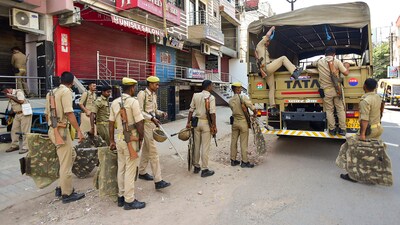 Security personnel being deployed in an area in view of Section 144 imposition in Uttar Pradesh after mafioso-turned-politician Atiq Ahmed and his brother Khalid Azim aka Ashraf were shot dead in Prayagraj. (PTI) Security personnel being deployed in an area in view of Section 144 imposition in Uttar Pradesh after mafioso-turned-politician Atiq Ahmed and his brother Khalid Azim aka Ashraf were shot dead in Prayagraj. (PTI)