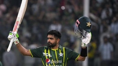 Pakistan's Babar Azam is acknowledged by crowd after his century as he walks off the field during the second twenty20 cricket match between Pakistan and New Zealand, in Lahore, Pakistan, Saturday, April 15, 2023. (AP Photo/K.M. Chaudary) (AP)