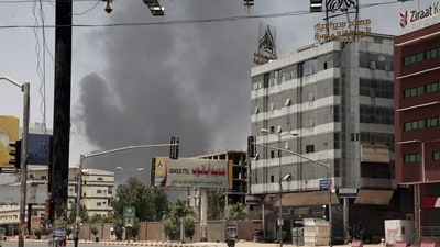 Smoke is seen rising from a neighborhood in Khartoum, Sudan, Saturday, April 15. (AP) Smoke is seen rising from a neighborhood in Khartoum, Sudan, Saturday, April 15. (AP)