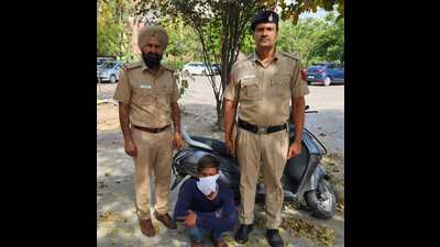The accused in the custody of Chandigarh police. He had stolen the scooter from Phase 11, Mohali. (HT Photo)