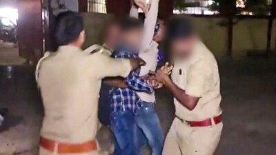 Policemen attempt to apprehend an assailant who opened fire at Gangster-turned-politician Atiq Ahmed and his brother Ashraf Ahmed in Prayagraj, Saturday. (PTI) Policemen attempt to apprehend an assailant who opened fire at Gangster-turned-politician Atiq Ahmed and his brother Ashraf Ahmed in Prayagraj, Saturday. (PTI)