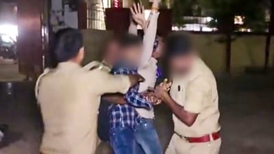 Policemen attempt to apprehend an assailant who opened fire at Gangster-turned-politician Atiq Ahmed and his brother Ashraf Ahmed while they were being taken for a medical checkup, in Prayagraj. (PTI) Policemen attempt to apprehend an assailant who opened fire at Gangster-turned-politician Atiq Ahmed and his brother Ashraf Ahmed while they were being taken for a medical checkup, in Prayagraj. (PTI)