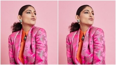 Kubbra further accessorised her look for the day in a silver pendant with emerald stone studded in it, and matching earrings from the shelves of Anmol Jewellers. Styled by fashion stylist house Who Wore What When, Kubbra wore her tresses into a clean ponytail.&nbsp; (Instagram/@kubbrasait)