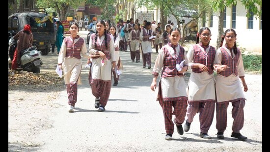 Students coming out of an exam centre after the test in Ludhiana on Sunday. (Manish/HT)