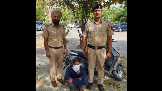 The accused in the custody of Chandigarh police. He had stolen the scooter from Phase 11, Mohali. (HT Photo)