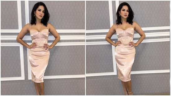 Sunny Leone is an absolute fashionista. The actor keeps slaying fashion goals like a pro with snippets from her fashion diaries on her Instagram profile on a regular basis. From acing casual ensembles to festive attires to being the boss babe in a formal power suit, Sunny can do it all. The actor, a day back, shared a slew of pictures of herself looking gorgeous in a satin short dress.(Instagram/@sunnyleone)