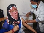 A healthcare worker inoculates a beneficiary with a booster dose of COVID-19 vaccine on Monday. (ANI Photo) A healthcare worker inoculates a beneficiary with a booster dose of COVID-19 vaccine on Monday. (ANI Photo)