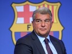 Barcelona's President Joan Laporta presents documents as he addresses a press conference at the Camp Nou stadium in Barcelona. Barcelona's President Joan Laporta presents documents as he addresses a press conference at the Camp Nou stadium in Barcelona.