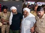 Gangster-politician Atiq Ahmed and his brother Ashraf Ahmed being escorted to a hospital by police for a medical check-up, in Prayagraj, Saturday, April 15, 2023. (PTI Photo) Gangster-politician Atiq Ahmed and his brother Ashraf Ahmed being escorted to a hospital by police for a medical check-up, in Prayagraj, Saturday, April 15, 2023. (PTI Photo)