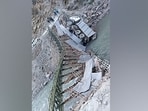 An iron bridge on the Dhauliganga river, connecting Niti Valley in Chamoli district snapped suddenly