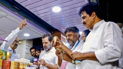 Bengaluru, Apr 17 (ANI): Congress leader Rahul Gandhi, Karnataka Congress President DK Shivakumar and general secretary KC Venugopal visited Nandini Milk parlour at JP Nagar, in Bengaluru on Sunday. (ANI Photo) (Congress Twitter) Bengaluru, Apr 17 (ANI): Congress leader Rahul Gandhi, Karnataka Congress President DK Shivakumar and general secretary KC Venugopal visited Nandini Milk parlour at JP Nagar, in Bengaluru on Sunday. (ANI Photo) (Congress Twitter)