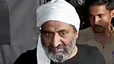 Police personnel escort Mafia-turned-politician Atiq Ahmad for a medical examination, in Prayagraj. Atiq's brother Khalid Azim alias Ashraf also seen. (ANI file) Police personnel escort Mafia-turned-politician Atiq Ahmad for a medical examination, in Prayagraj. Atiq's brother Khalid Azim alias Ashraf also seen. (ANI file)