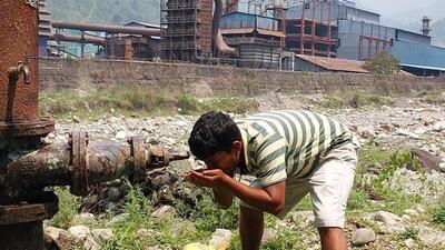 Locals drink water from the same Singhi jhora (stream) where the Pasakha Industrial Estate discharges its waste water. (HT Photo) Locals drink water from the same Singhi jhora (stream) where the Pasakha Industrial Estate discharges its waste water. (HT Photo)