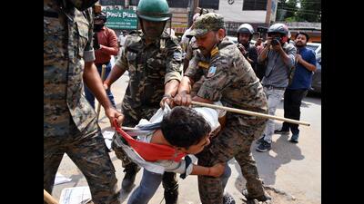 Police detain a student during a protest march in Ranchi on Monday. (ANI) Police detain a student during a protest march in Ranchi on Monday. (ANI)