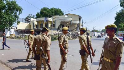 Police personnel outside the Kasari Masari office of Atiq Ahmad in Prayagraj on Monday. (PTI) Police personnel outside the Kasari Masari office of Atiq Ahmad in Prayagraj on Monday. (PTI)