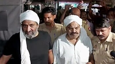 Police personnel escort Mafia-turned-politician Atiq Ahmad for a medical examination, in Prayagraj. Atiq's brother Khalid Azim alias Ashraf also seen. (ANI file) Police personnel escort Mafia-turned-politician Atiq Ahmad for a medical examination, in Prayagraj. Atiq's brother Khalid Azim alias Ashraf also seen. (ANI file)