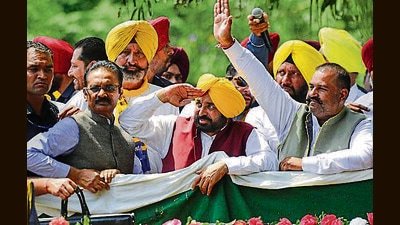 Punjab CM Bhagwant Mann during a roadshow before the nomintion filing of AAP candidate Sushil Kumar Rinku for Jalandhar Lok Sabha bypoll in Jalandhar on Monday. (PTI)