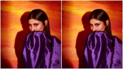 Mouni looked stunning in the attire featuring one shoulder detail and a dramatic sleeve on one side. The silk dress came with ruched bodycon details and featured a statement knot on one side with a train. (Instagram/@imouniroy) Mouni looked stunning in the attire featuring one shoulder detail and a dramatic sleeve on one side. The silk dress came with ruched bodycon details and featured a statement knot on one side with a train. (Instagram/@imouniroy)